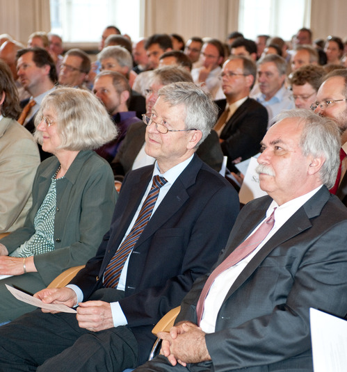 VIP guests and speakers listening to the program