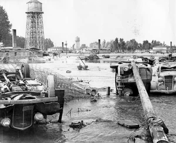 Overturned cars in Vanport, Oregon, following the flood of 1948 that wiped out the town.
